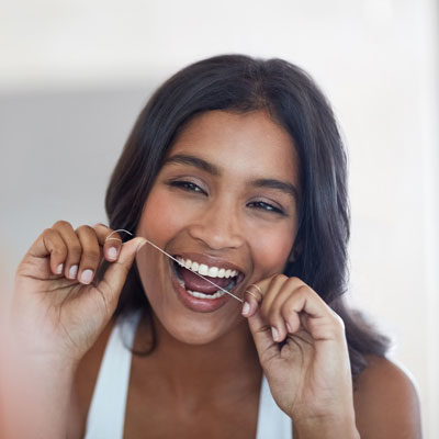 woman flossing